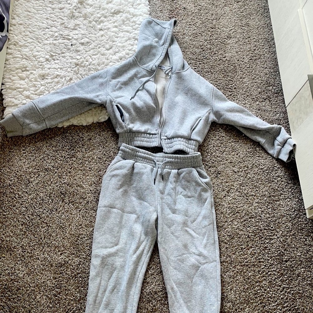 Two piece gray jumpsuit with cropped zip up hoodie